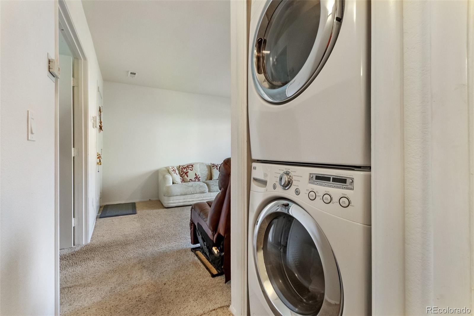 2265 South Buckley Road, Unit 102 Aurora, CO 80013 - Photo 26 of 28 a view of a storage and utility room with dryer and washer