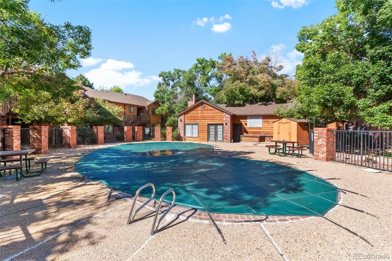 2265 South Buckley Road, Unit 102 Aurora, CO 80013 - Photo 28 of 28 a backyard of a house with table and chairs