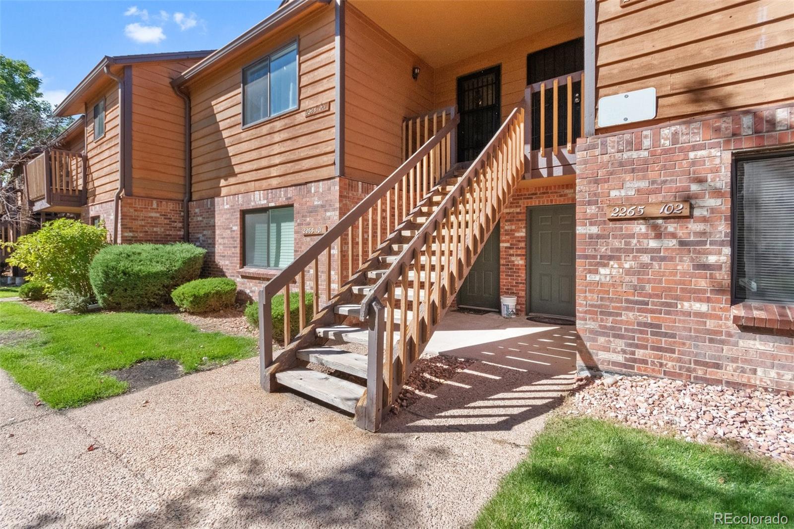 2265 South Buckley Road, Unit 102 Aurora, CO 80013 - Photo 3 of 28 a view of a house with a yard