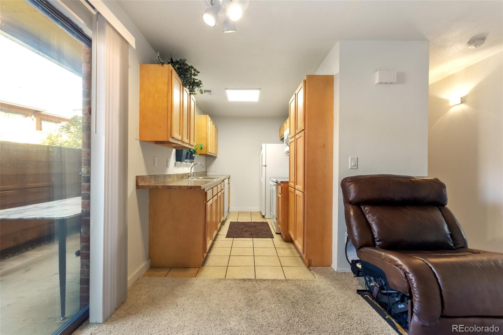 2265 South Buckley Road, Unit 102 Aurora, CO 80013 - Photo 10 of 28 a view of a hallway with workspace and a window