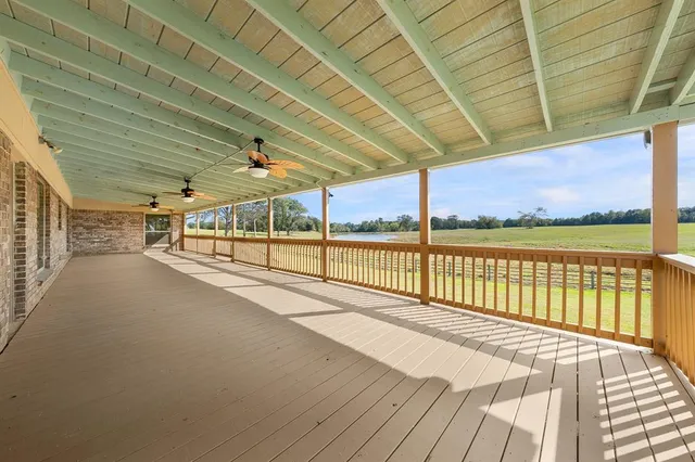 a view of a backyard with a garden and entertaining space