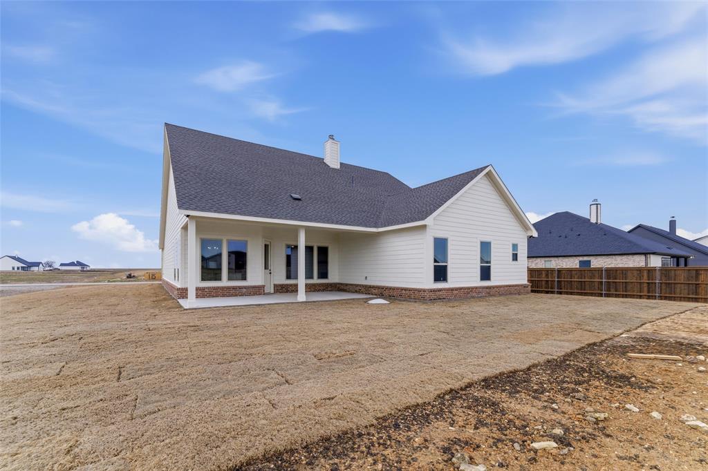 114 Brandywine Trail Rhome, TX 76078 - Photo 26 of 27 a view of a house with a yard