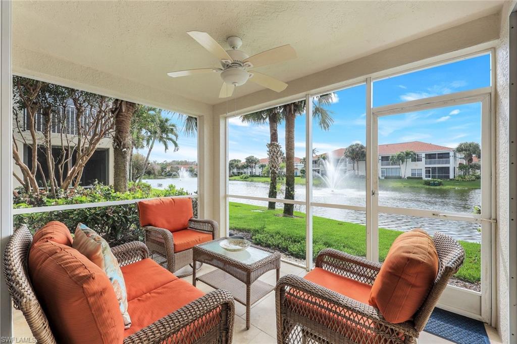 23711 Old Port Road, Unit 101 Estero, FL 34135 - Photo 1 of 30 Sunroom with a water view and ceiling fan
