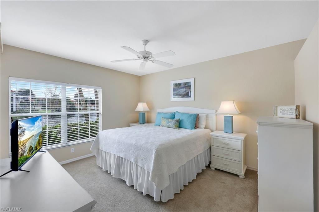23711 Old Port Road, Unit 101 Estero, FL 34135 - Photo 15 of 30 Carpeted bedroom featuring ceiling fan