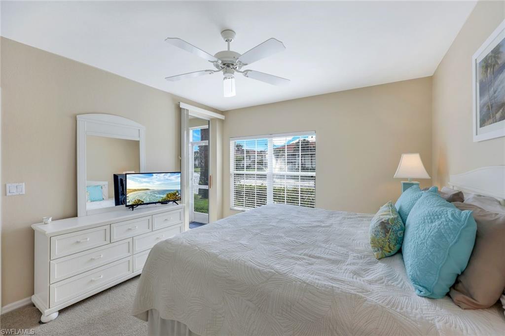 23711 Old Port Road, Unit 101 Estero, FL 34135 - Photo 16 of 30 Bedroom featuring light colored carpet and ceiling fan