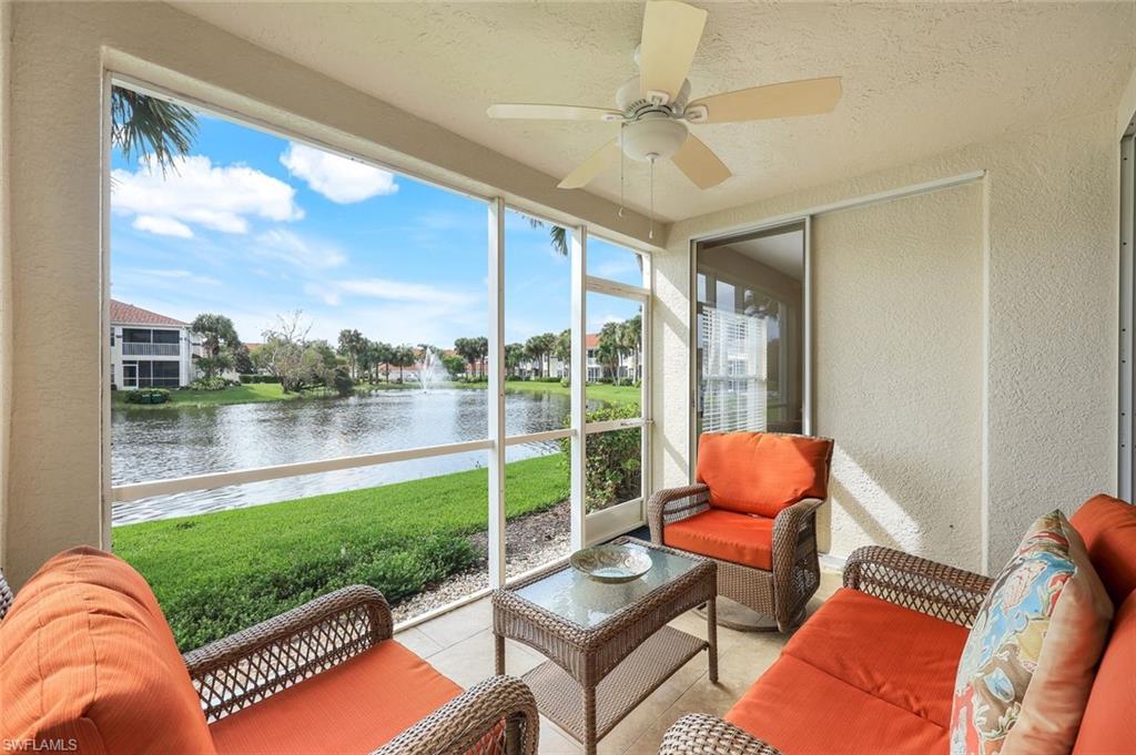 23711 Old Port Road, Unit 101 Estero, FL 34135 - Photo 22 of 30 Sunroom featuring a water view and ceiling fan