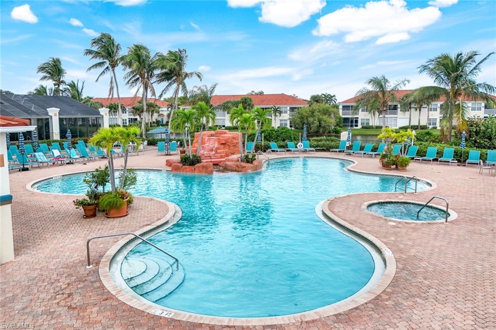 23711 Old Port Road, Unit 101 Estero, FL 34135 - Photo 26 of 30 View of pool with a hot tub and a patio area