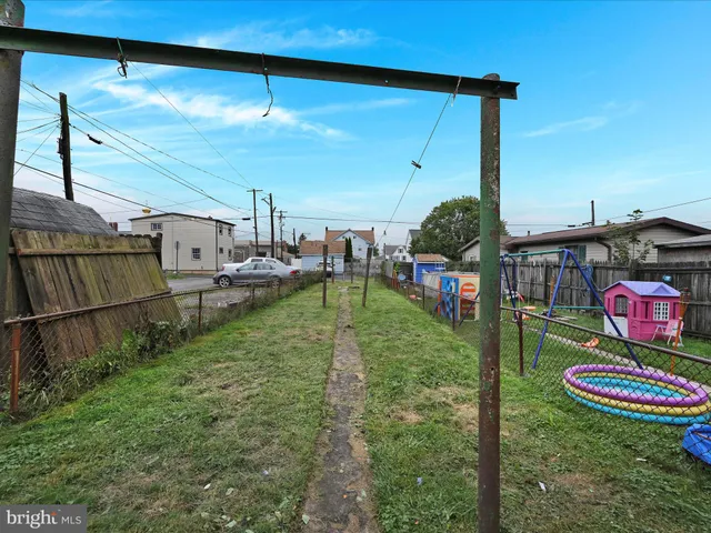 a view of a backyard with sitting area