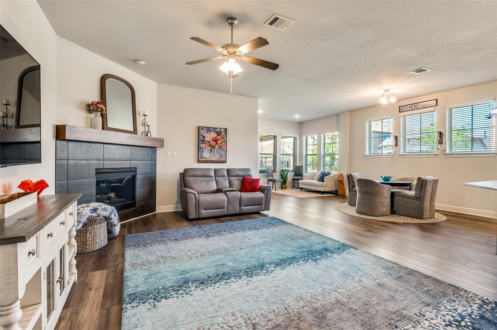 4724 Raspberry Spar Court Arlington, TX 76005 - Photo 10 of 30 a living room with furniture and a fireplace