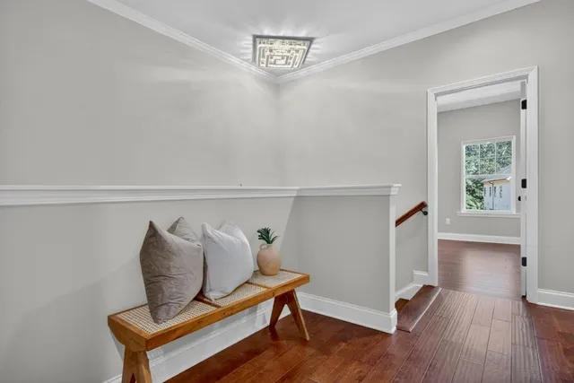 a view of room with furniture and wooden floor