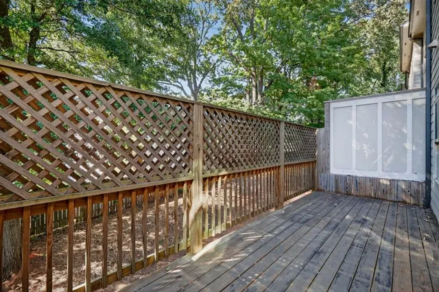 a view of balcony with wooden floor