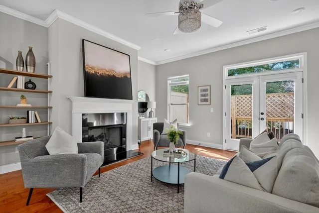 a living room with furniture fireplace and a flat screen tv