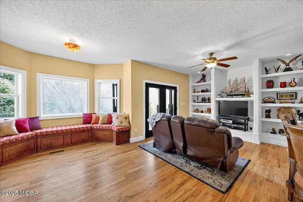 a bedroom with a large bed and a couch