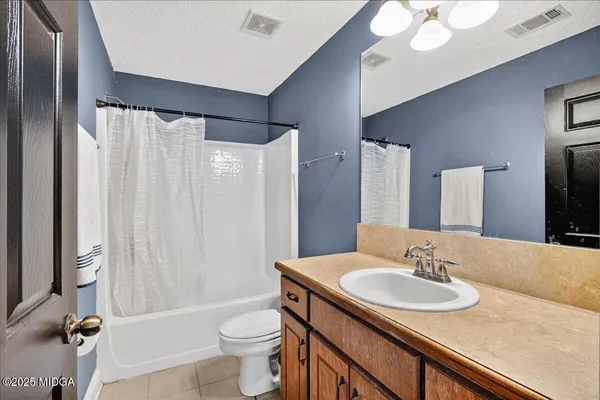 a view of a balcony with wooden floor and fence