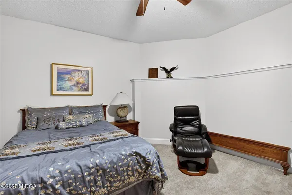 a view of balcony with wooden floor and fence and a porch