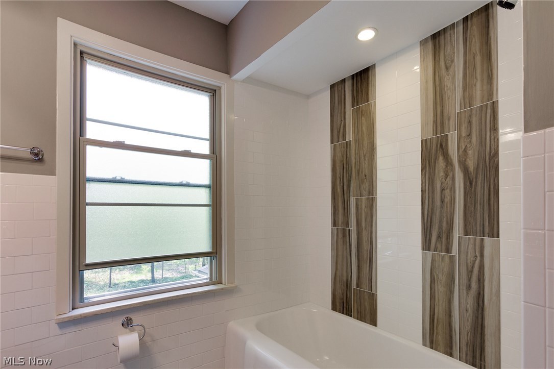 1046 Allston Road Cleveland Heights, OH 44121 - Photo 28 of 34 The main bathroom tub surround has matching tile from the floor for custom look!