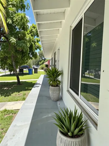 a view of a house with a small yard