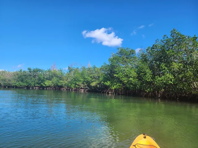 a view of a lake with a yard