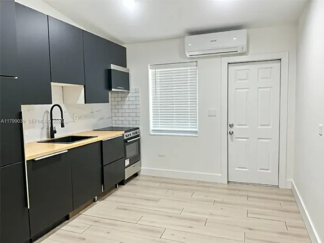 a spacious bathroom with a sink a vanity and a mirror