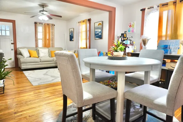 a view of a dining room with furniture and window