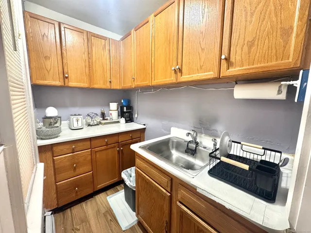 a kitchen with a sink cabinets and appliances