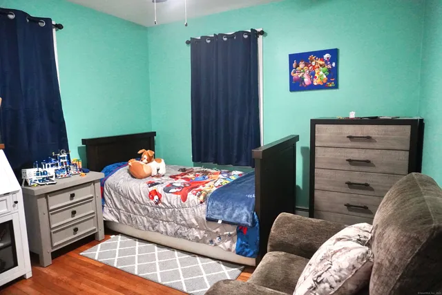 a bedroom with a bed and furniture