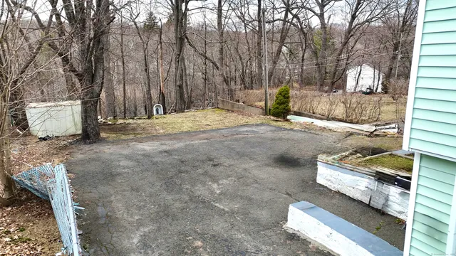 a view of backyard with trees