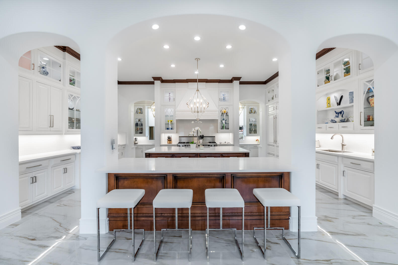 700 Northeast 45th Road Boca Raton, FL 33431 - Photo 12 of 62 a kitchen with cabinets and chairs
