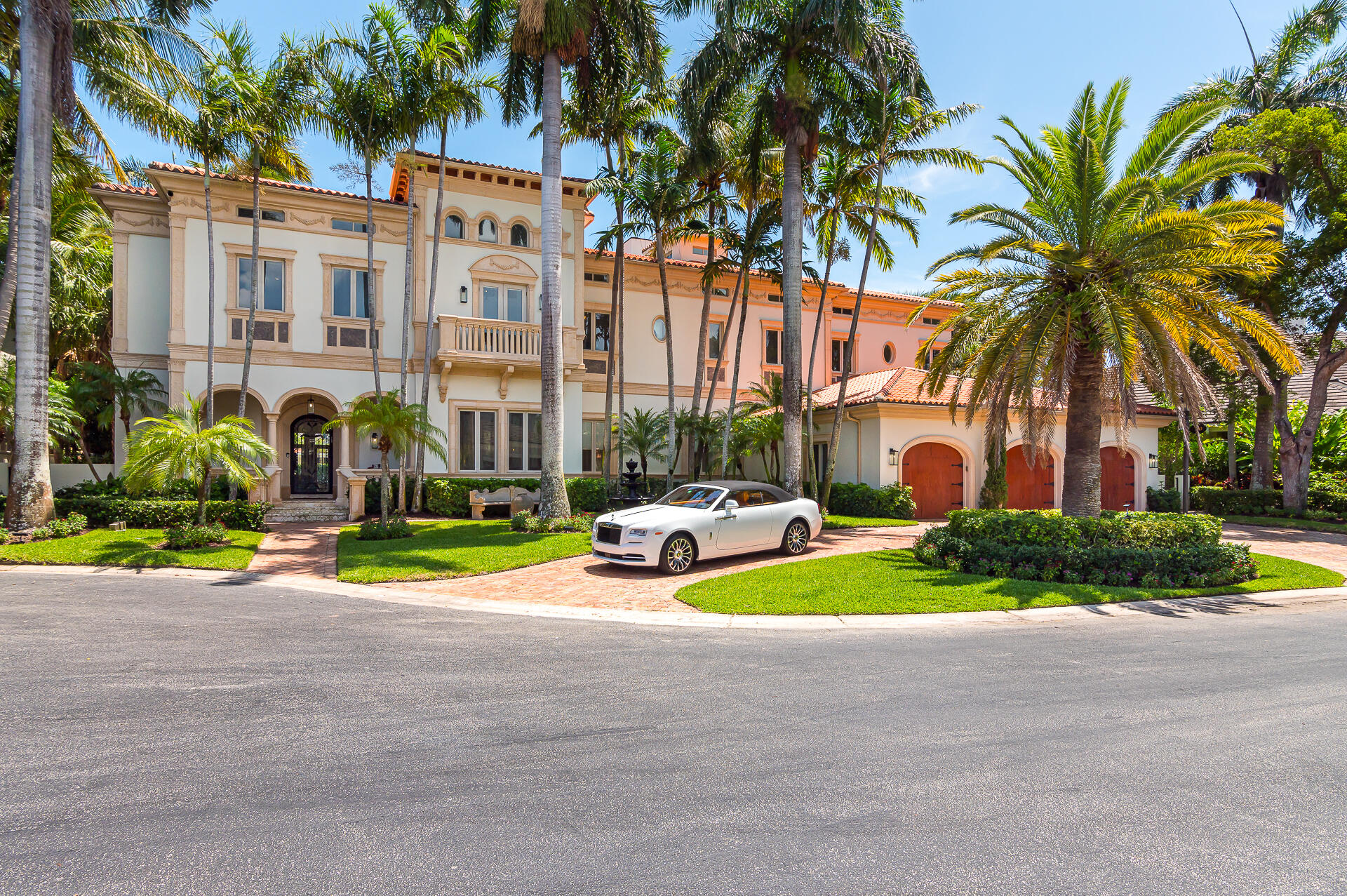 700 Northeast 45th Road Boca Raton, FL 33431 - Photo 2 of 62 a front view of multi story residential apartment building with yard and green space