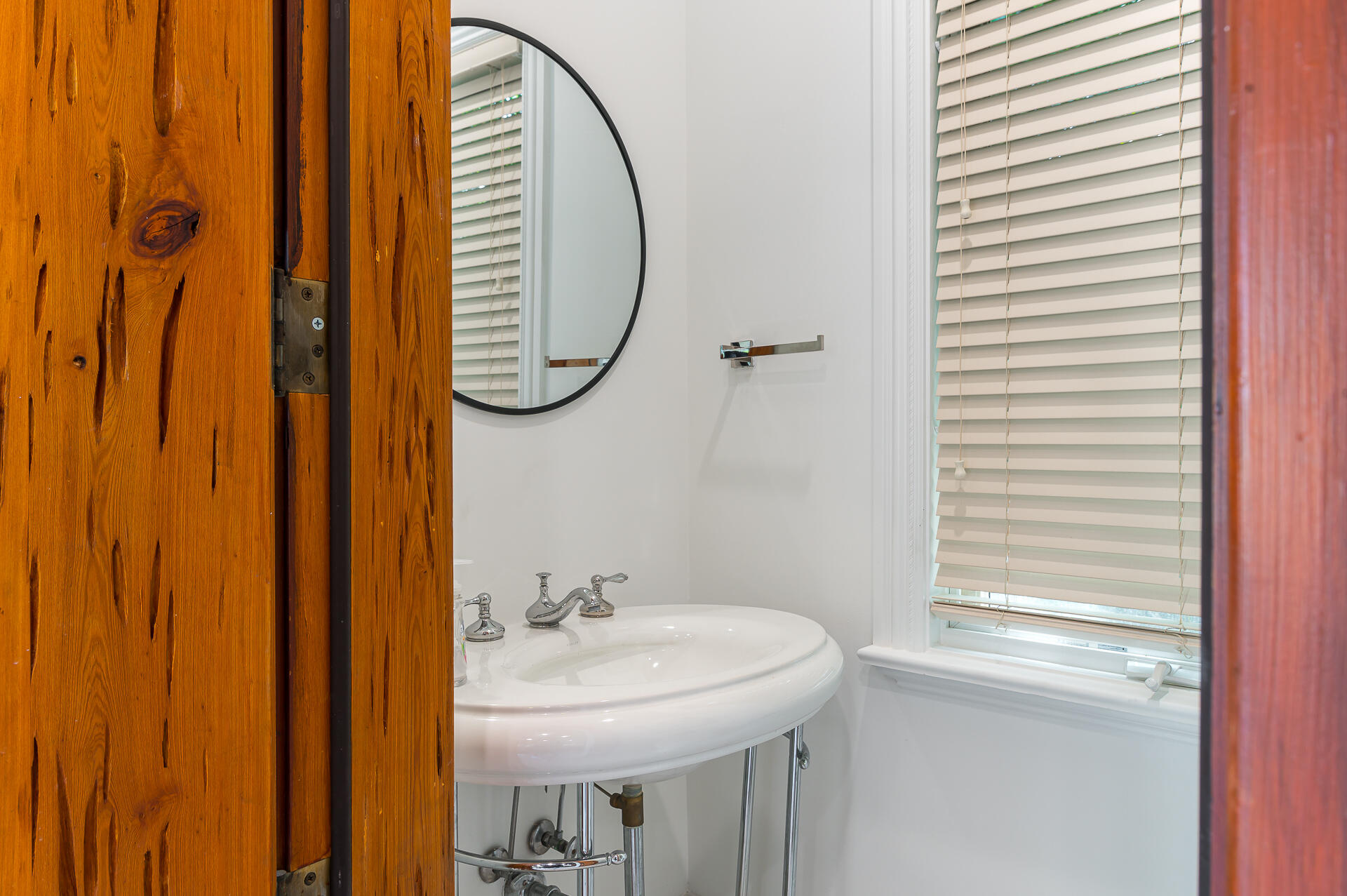 700 Northeast 45th Road Boca Raton, FL 33431 - Photo 27 of 62 a bathroom with a sink a mirror and a window