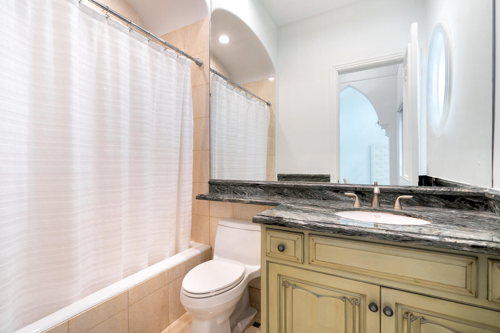 700 Northeast 45th Road Boca Raton, FL 33431 - Photo 38 of 62 a bathroom with a granite countertop sink and a mirror