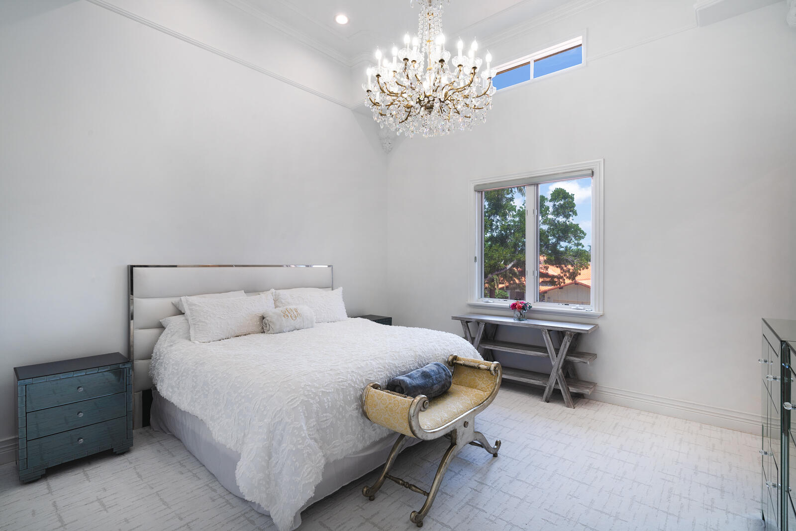 700 Northeast 45th Road Boca Raton, FL 33431 - Photo 42 of 62 a bedroom with a bed table chair and a window