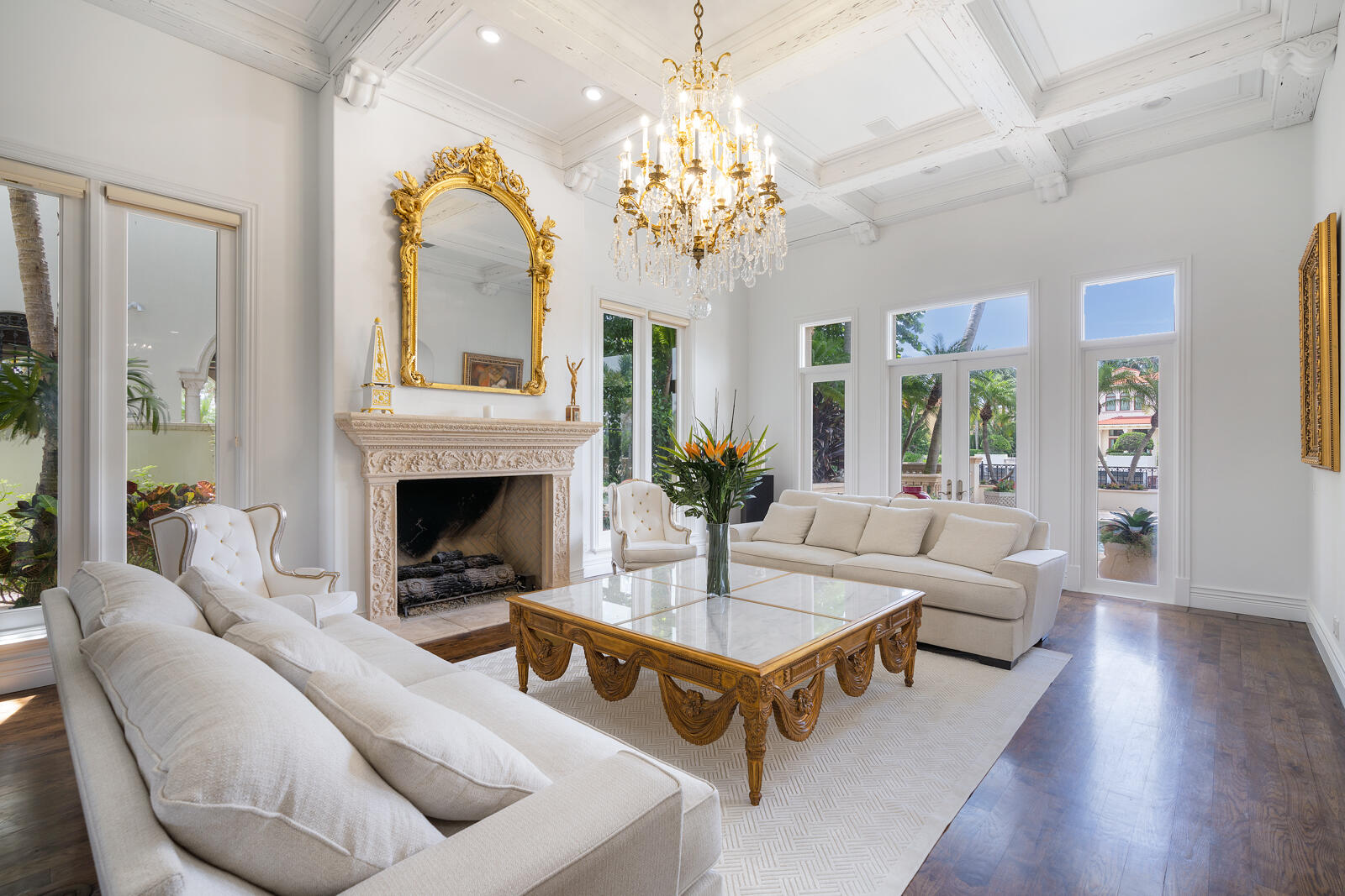 700 Northeast 45th Road Boca Raton, FL 33431 - Photo 7 of 62 a living room with furniture a chandelier and a fireplace