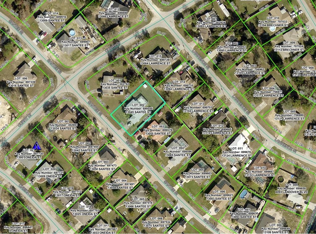 13045 Santee Street Spring Hill, FL 34609 - Photo 2 of 2 an aerial view of a multi story building with yard