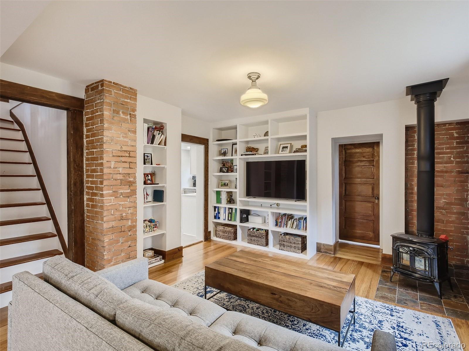 743 9th Street Boulder, CO 80302 - Photo 1 of 28 a living room with furniture and a flat screen tv