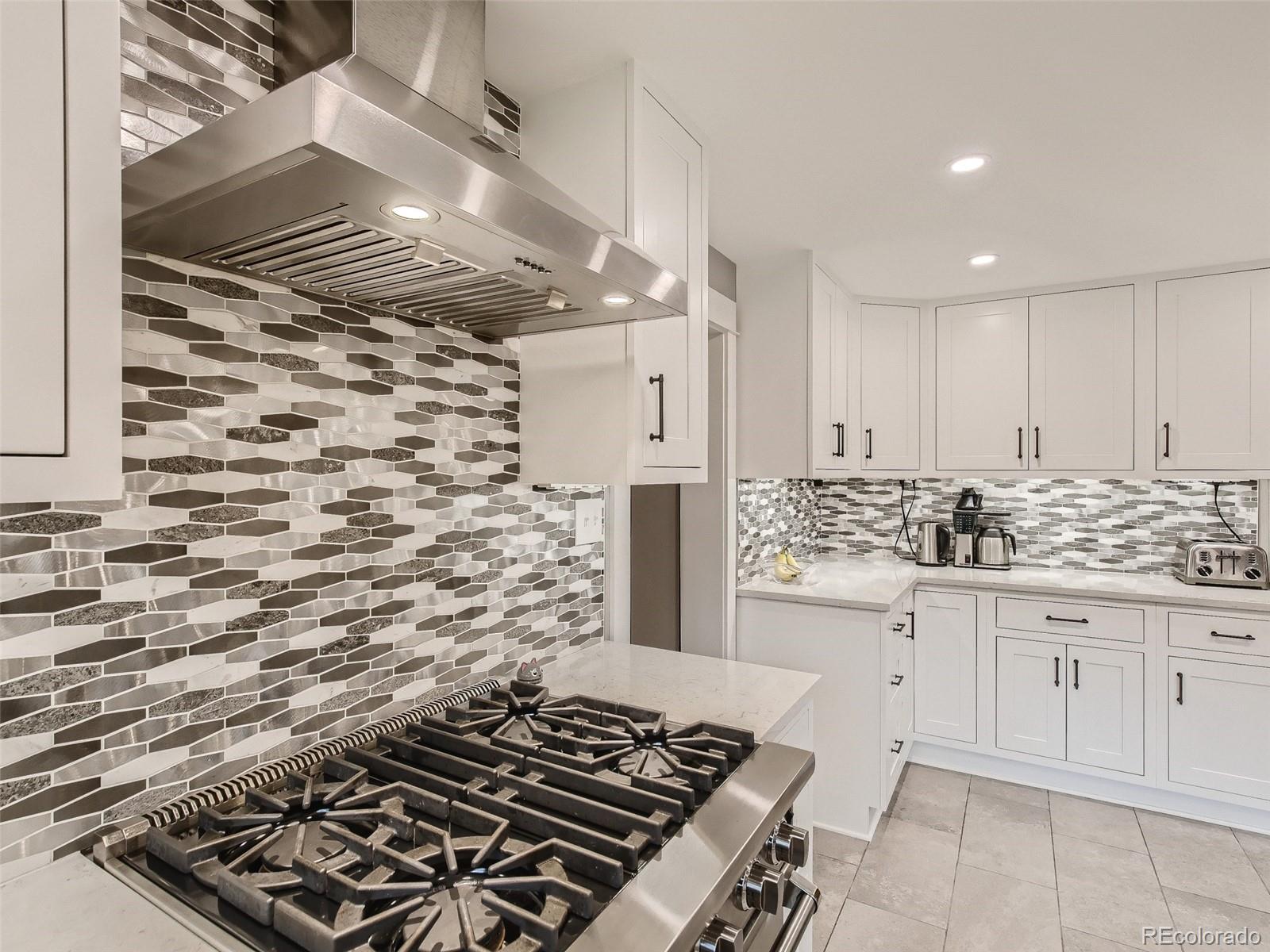 743 9th Street Boulder, CO 80302 - Photo 12 of 28 a kitchen with a stove and a refrigerator