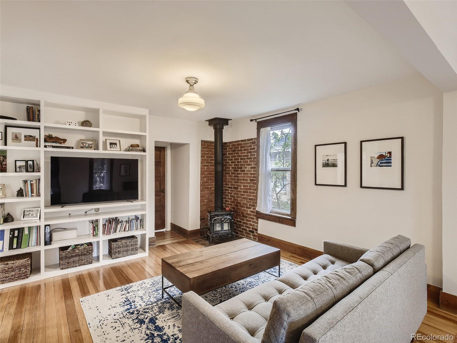 743 9th Street Boulder, CO 80302 - Photo 13 of 28 a living room with furniture and a flat screen tv