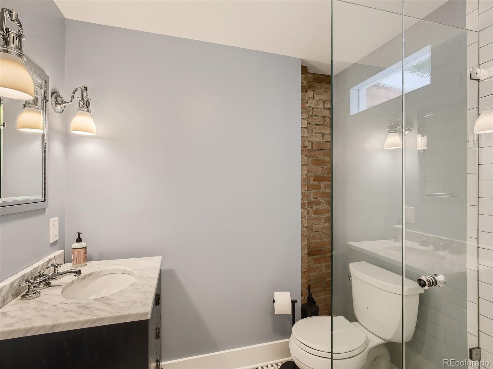 743 9th Street Boulder, CO 80302 - Photo 17 of 28 a bathroom with a sink toilet and shower
