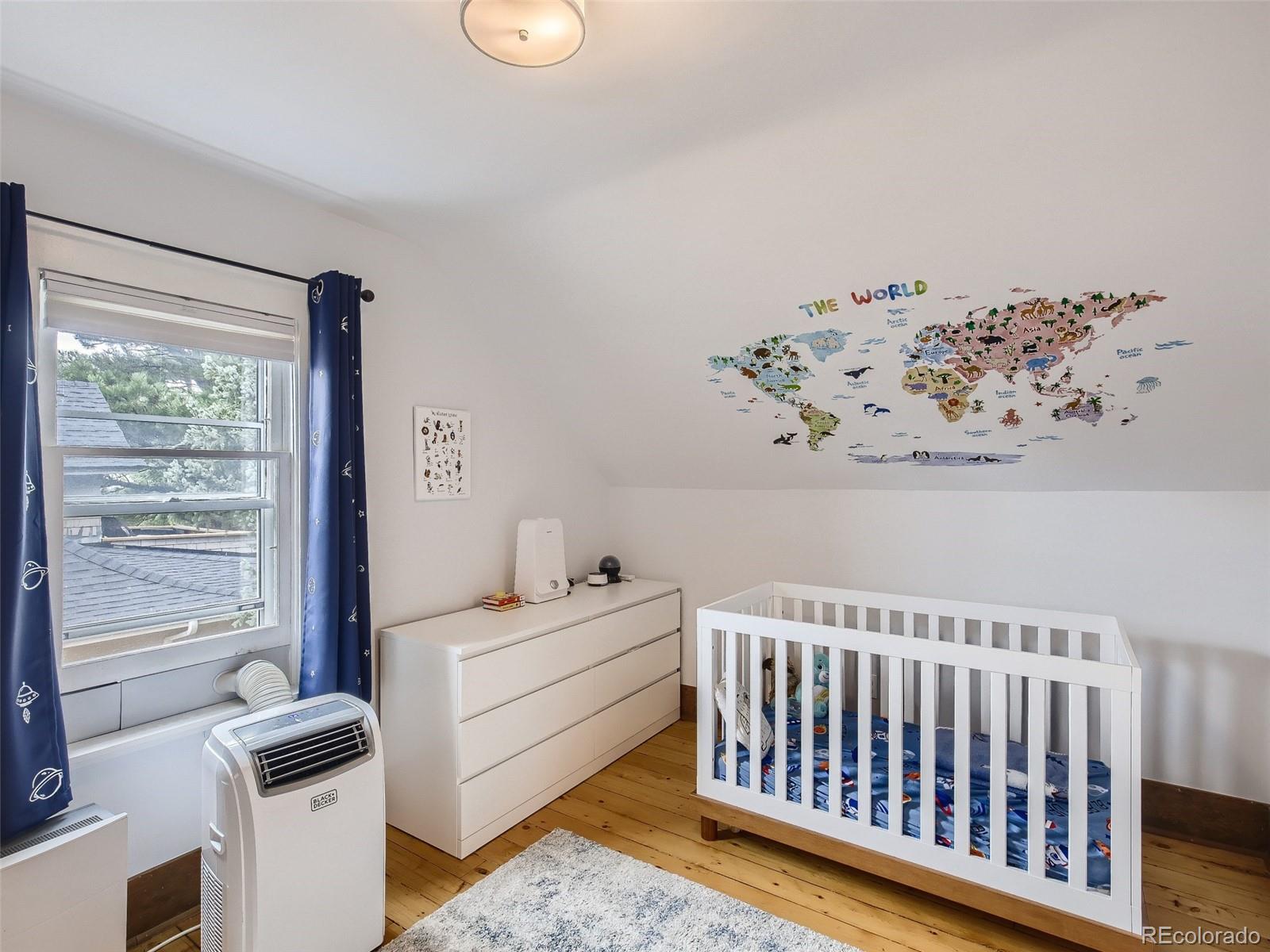 743 9th Street Boulder, CO 80302 - Photo 20 of 28 a bedroom with furniture and a window