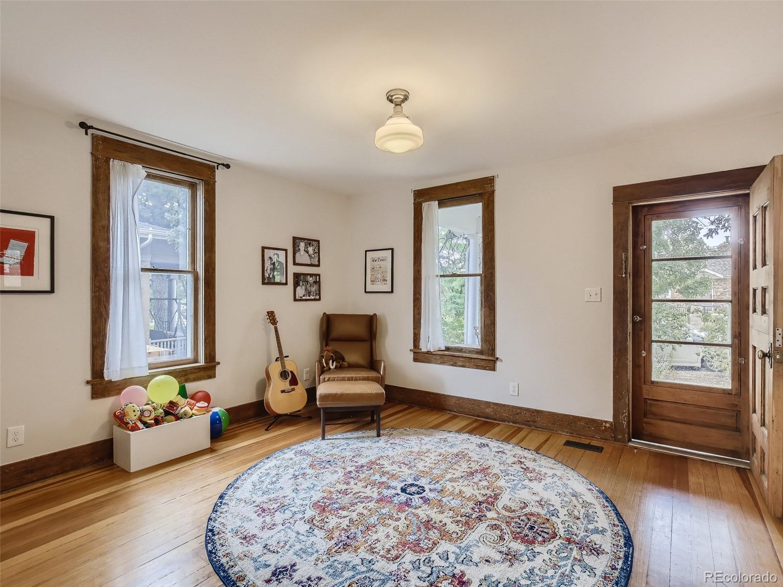 743 9th Street Boulder, CO 80302 - Photo 7 of 28 a living room with furniture and a window
