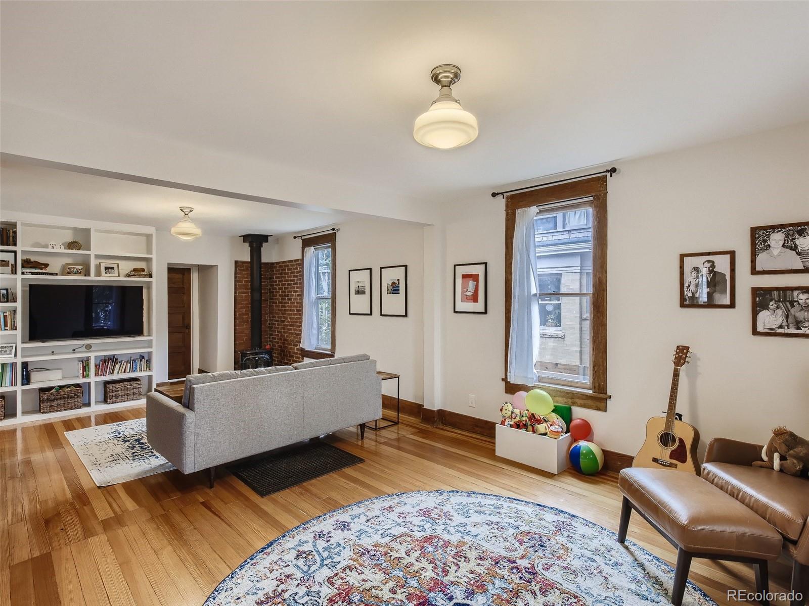 743 9th Street Boulder, CO 80302 - Photo 8 of 28 a living room with furniture and a flat screen tv