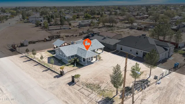 a spacious bedroom with a bed and a ceiling fan