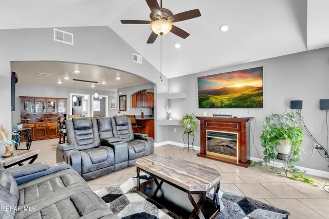 a kitchen with stainless steel appliances granite countertop a sink a stove and a refrigerator