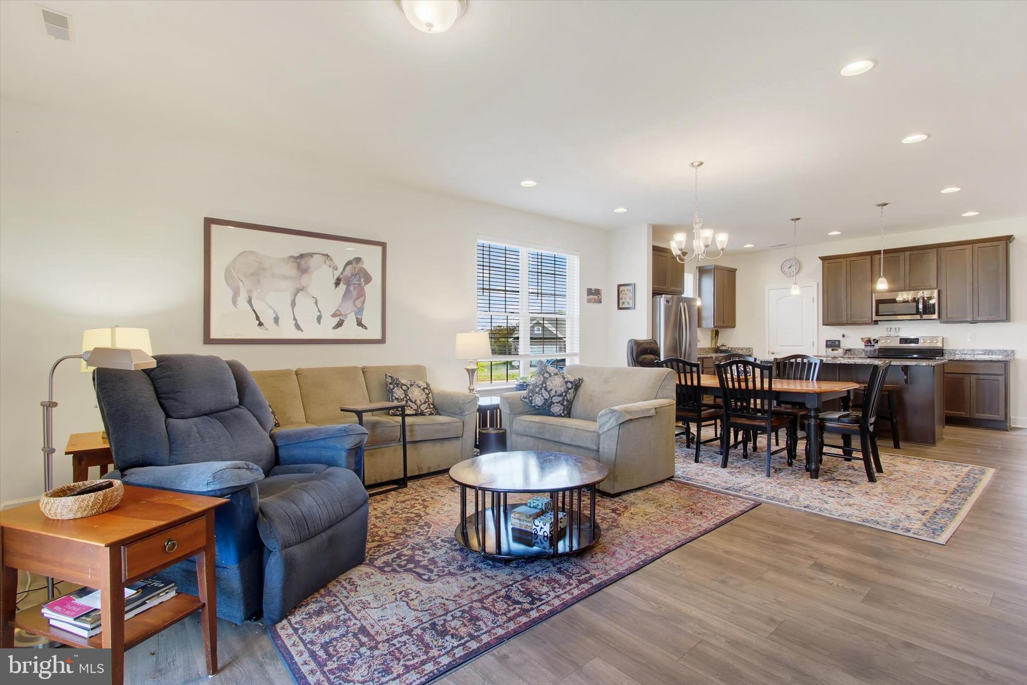 8 Osprey Court Gettysburg, PA 17325 - Photo 11 of 26 a living room with furniture and a dining table with kitchen view