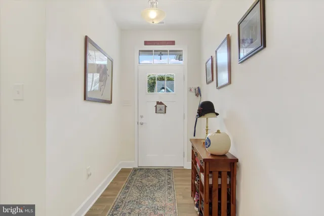 a view of hallway with furniture