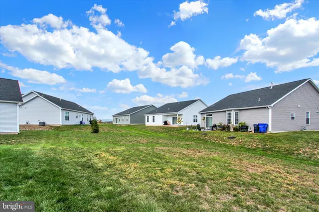 a big house with a big yard and large trees