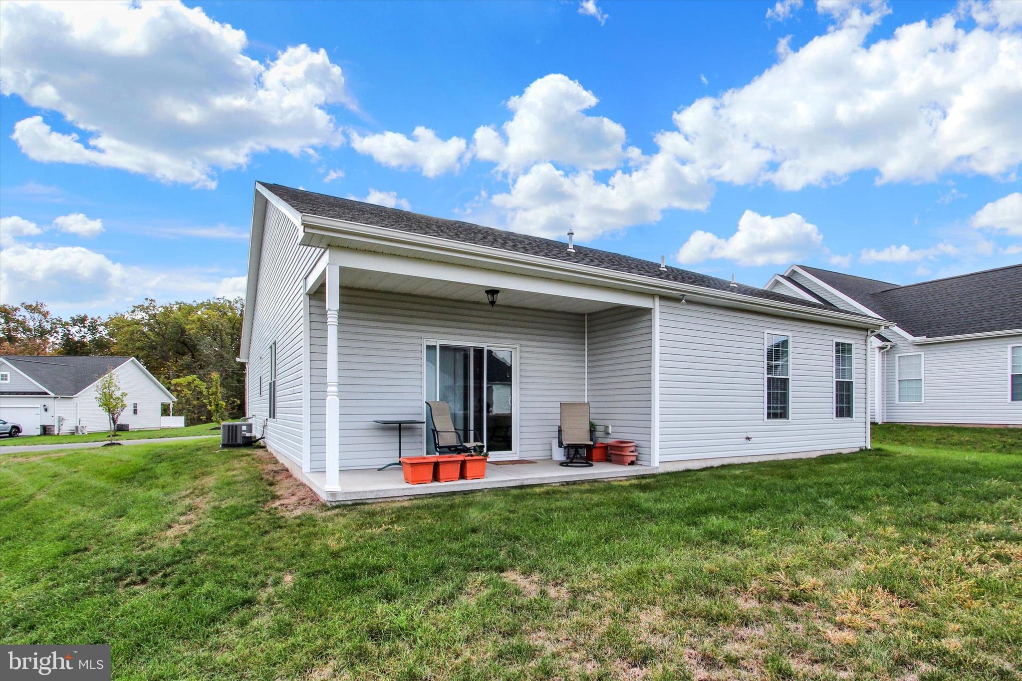 8 Osprey Court Gettysburg, PA 17325 - Photo 24 of 26 a view of a backyard with plants and a large tree