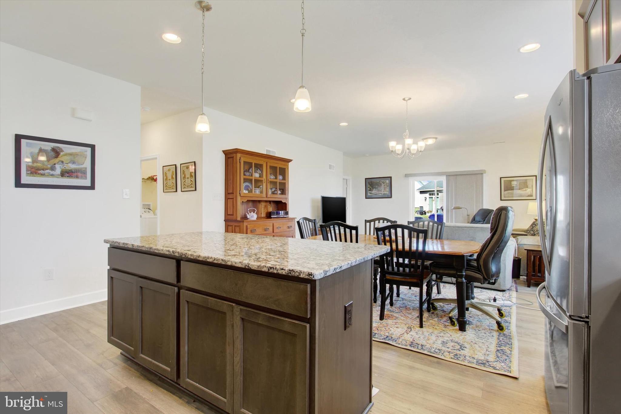 8 Osprey Court Gettysburg, PA 17325 - Photo 7 of 26 a dining hall with stainless steel appliances granite countertop a dining table and chairs