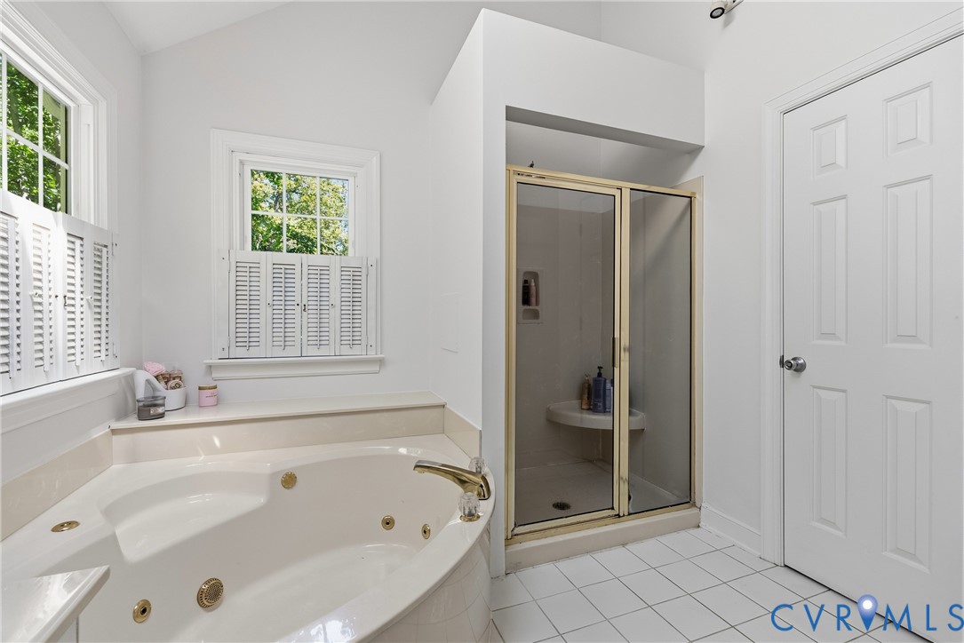 14321 Crossings Ridge Drive Midlothian, VA 23113 - Photo 33 of 43 a bathroom with a bathtub and a shower