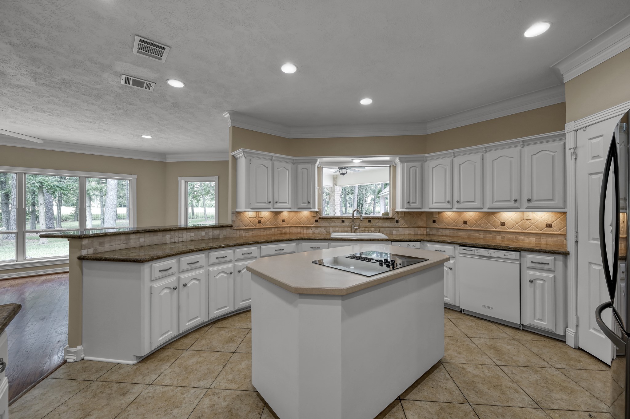 2205 Longmire Road Conroe, TX 77304 - Photo 14 of 49 Open concept kitchen opens up to the family room